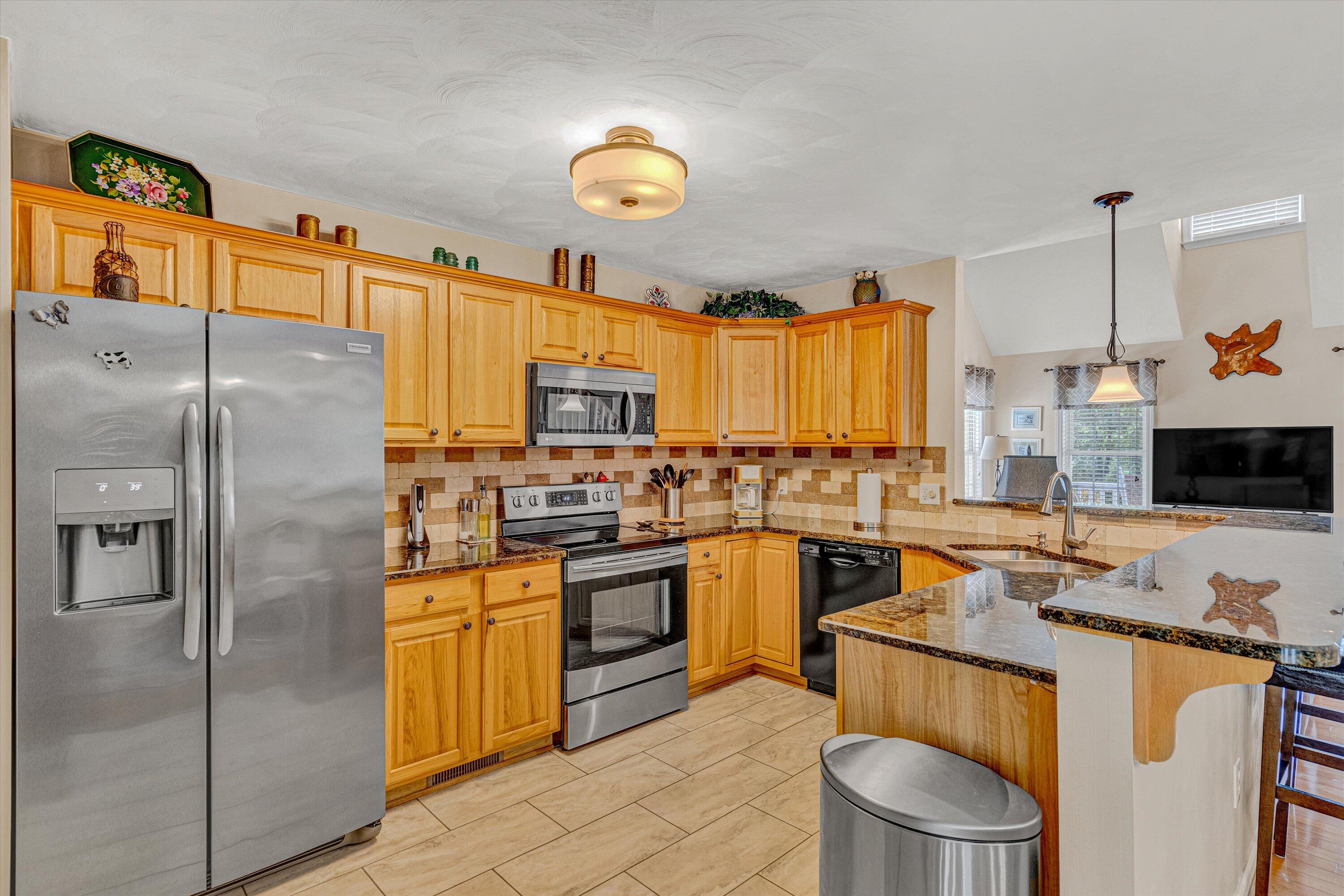1304 Virginia Ridge Drive Hardy, VA 24101 - Photo 14 of 33 a kitchen with stainless steel appliances granite countertop a stove a sink dishwasher a refrigerator and a microwave
