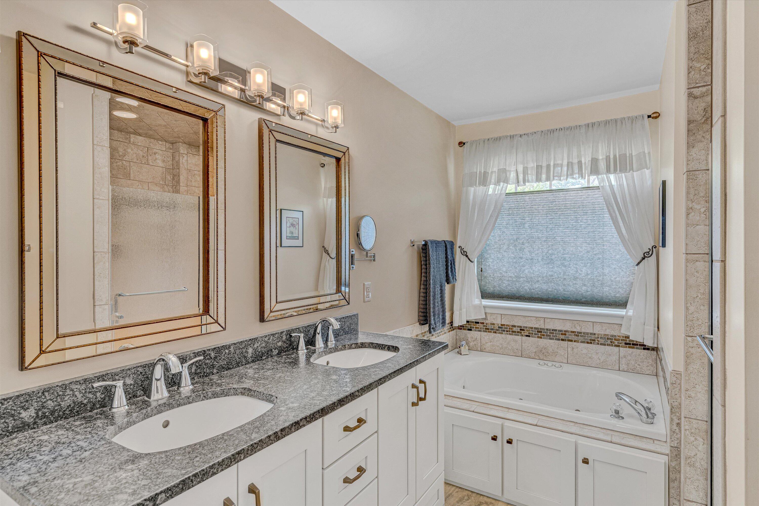 1304 Virginia Ridge Drive Hardy, VA 24101 - Photo 19 of 33 a bathroom with a granite countertop sink a mirror and a shower