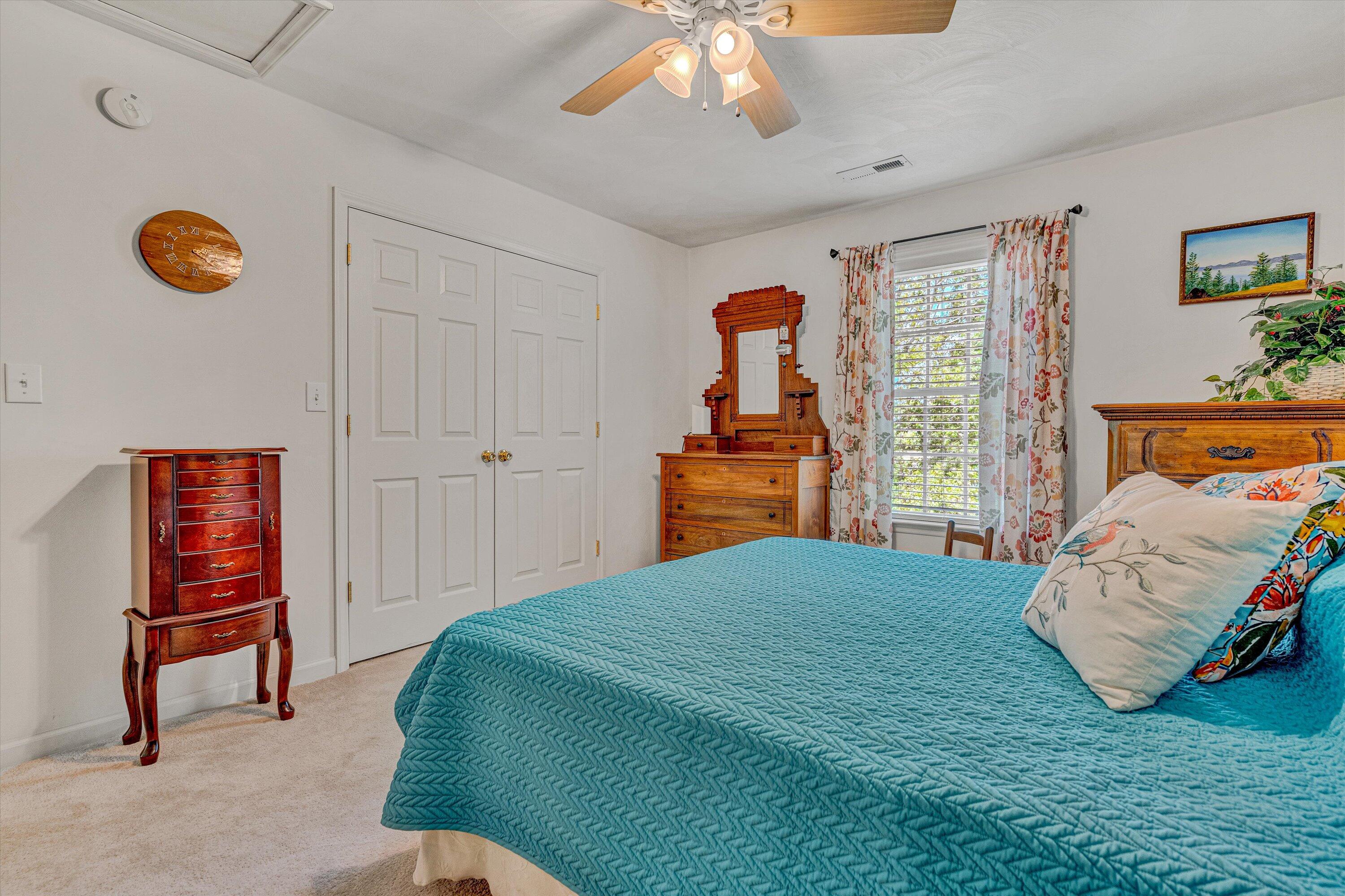 1304 Virginia Ridge Drive Hardy, VA 24101 - Photo 24 of 33 a bedroom with a bed and a chandelier