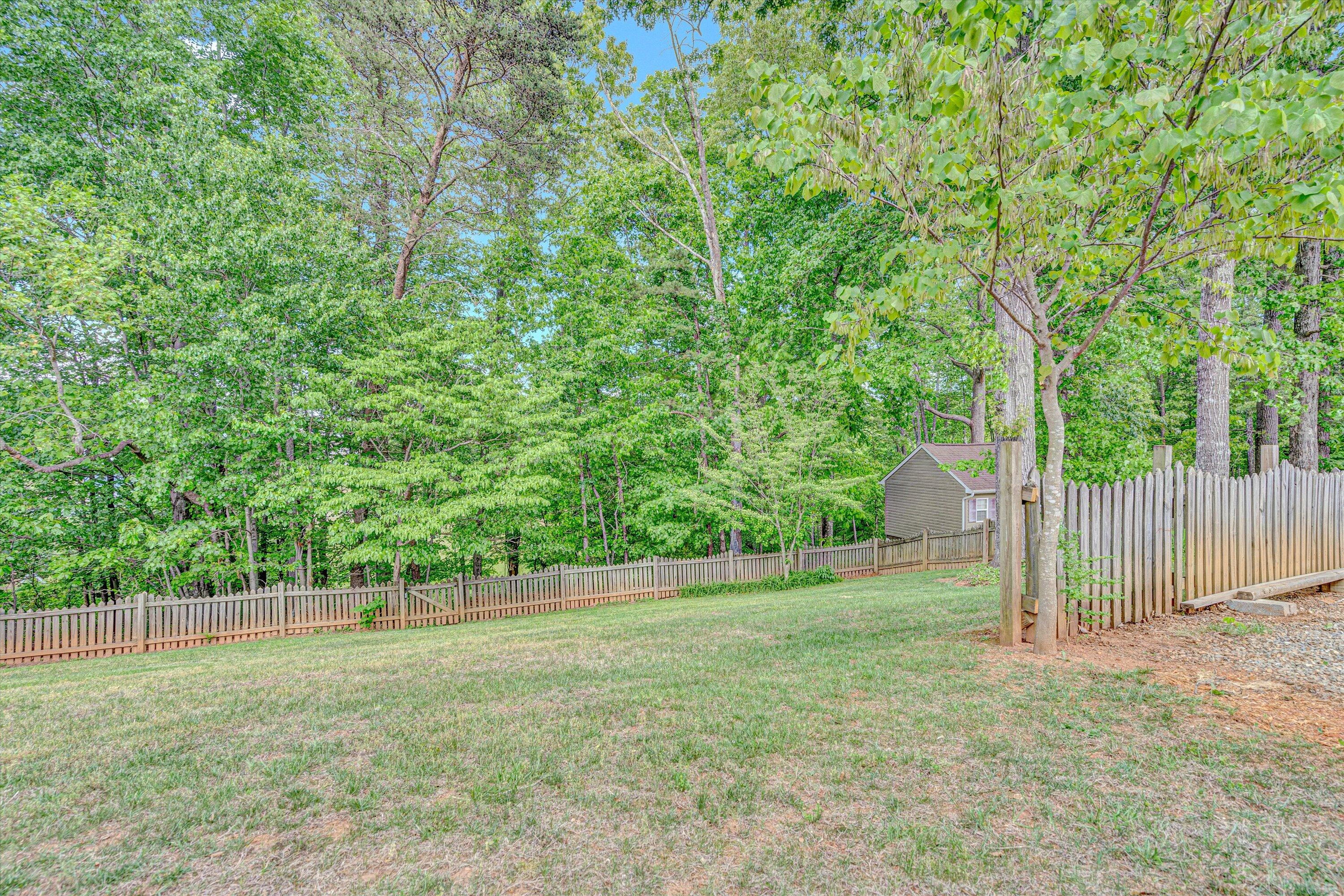 1304 Virginia Ridge Drive Hardy, VA 24101 - Photo 8 of 33 a view of a yard with a wooden fence