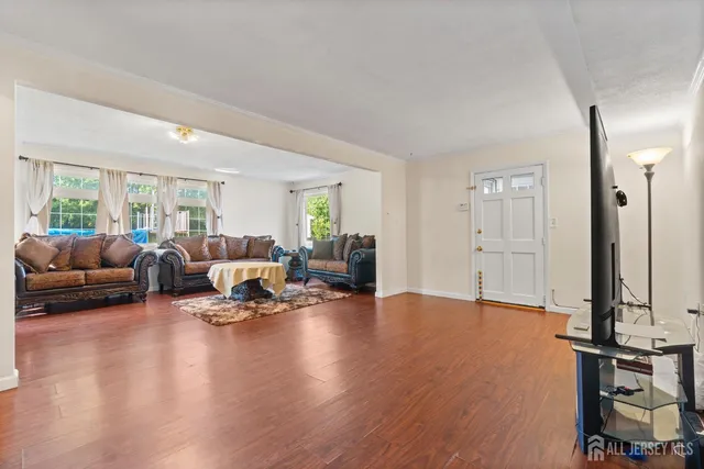 a living room with furniture window and a table