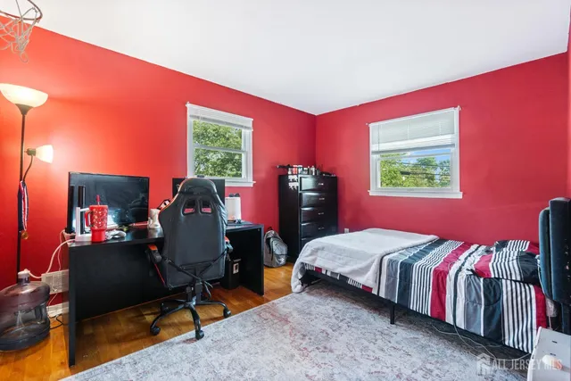 a bed room with a bed and a television