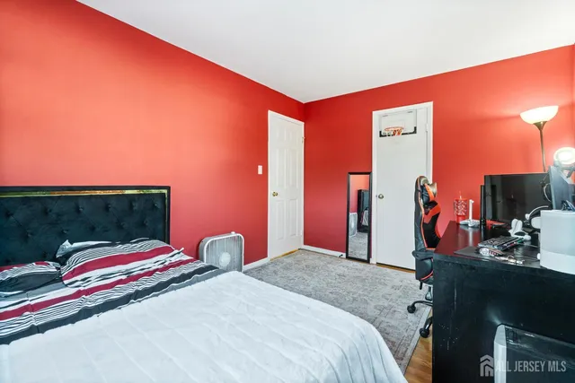 a spacious bathroom with a sink a toilet and a mirror