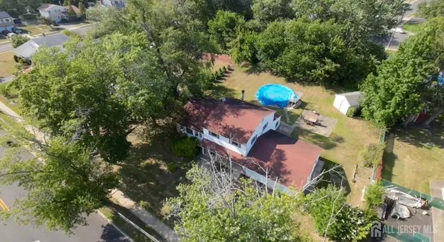 an aerial view of a house with outdoor space