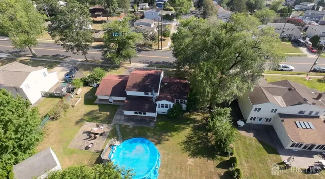a view of a small pool in the backyard