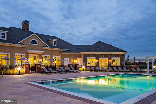 3210 Del Mar Drive Cherry Hill, NJ 08002 - Photo 12 of 27 a view of a swimming pool with outdoor seating and a lots of windows in the back