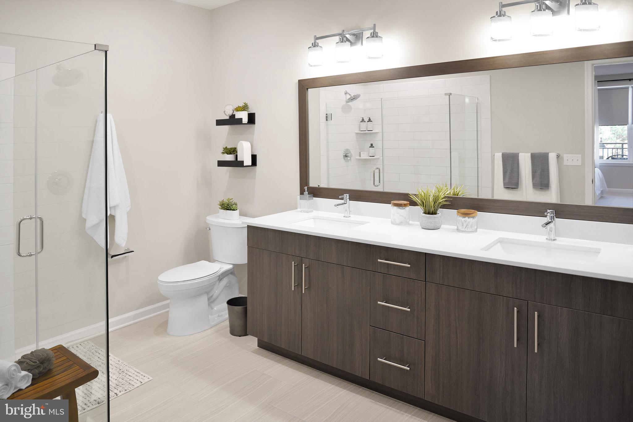 3210 Del Mar Drive Cherry Hill, NJ 08002 - Photo 21 of 27 a bathroom with a double vanity sink toilet and mirror