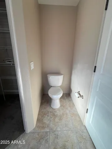 a bathroom with a toilet