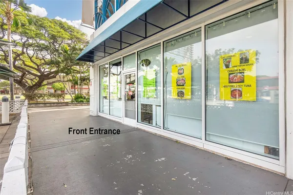 a view of an entrance to house with the street
