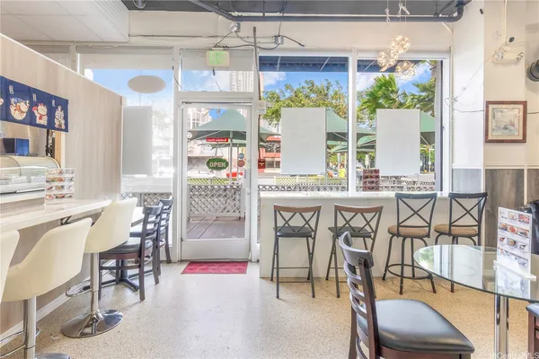 a dinning table and chairs in a room
