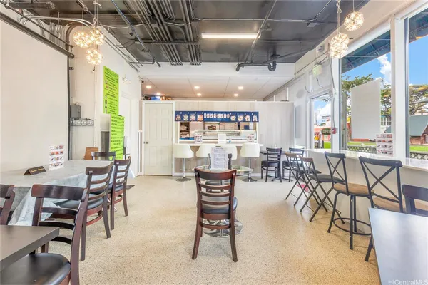 a living room with lots of furniture and a chandelier