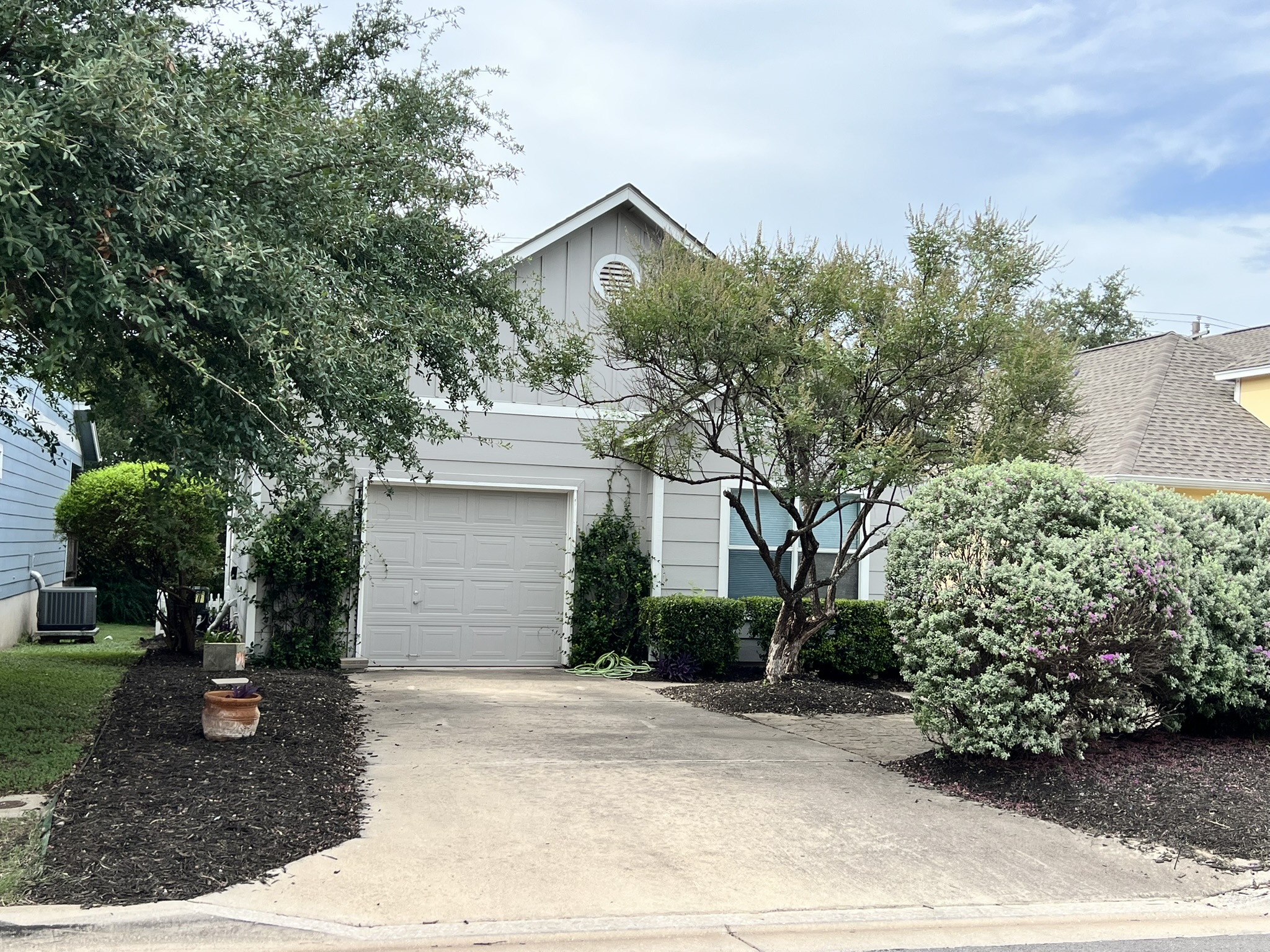 a front view of a house with garden