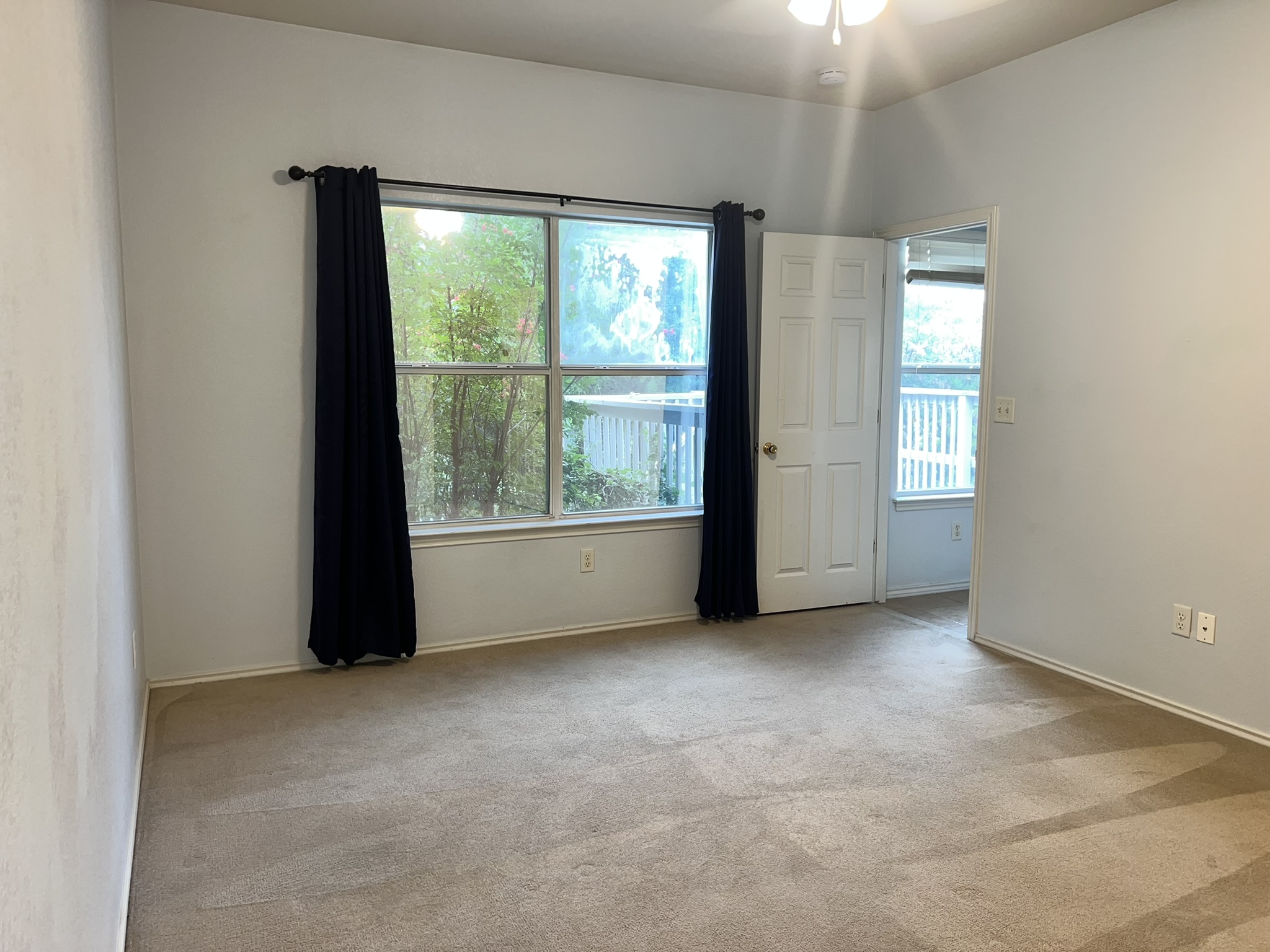 1310 East 3rd Street Georgetown, TX 78626 - Photo 3 of 13 an empty room with windows
