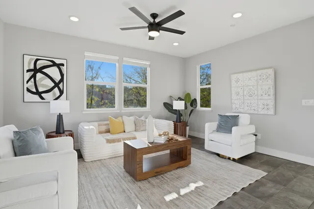a living room with furniture and a large window