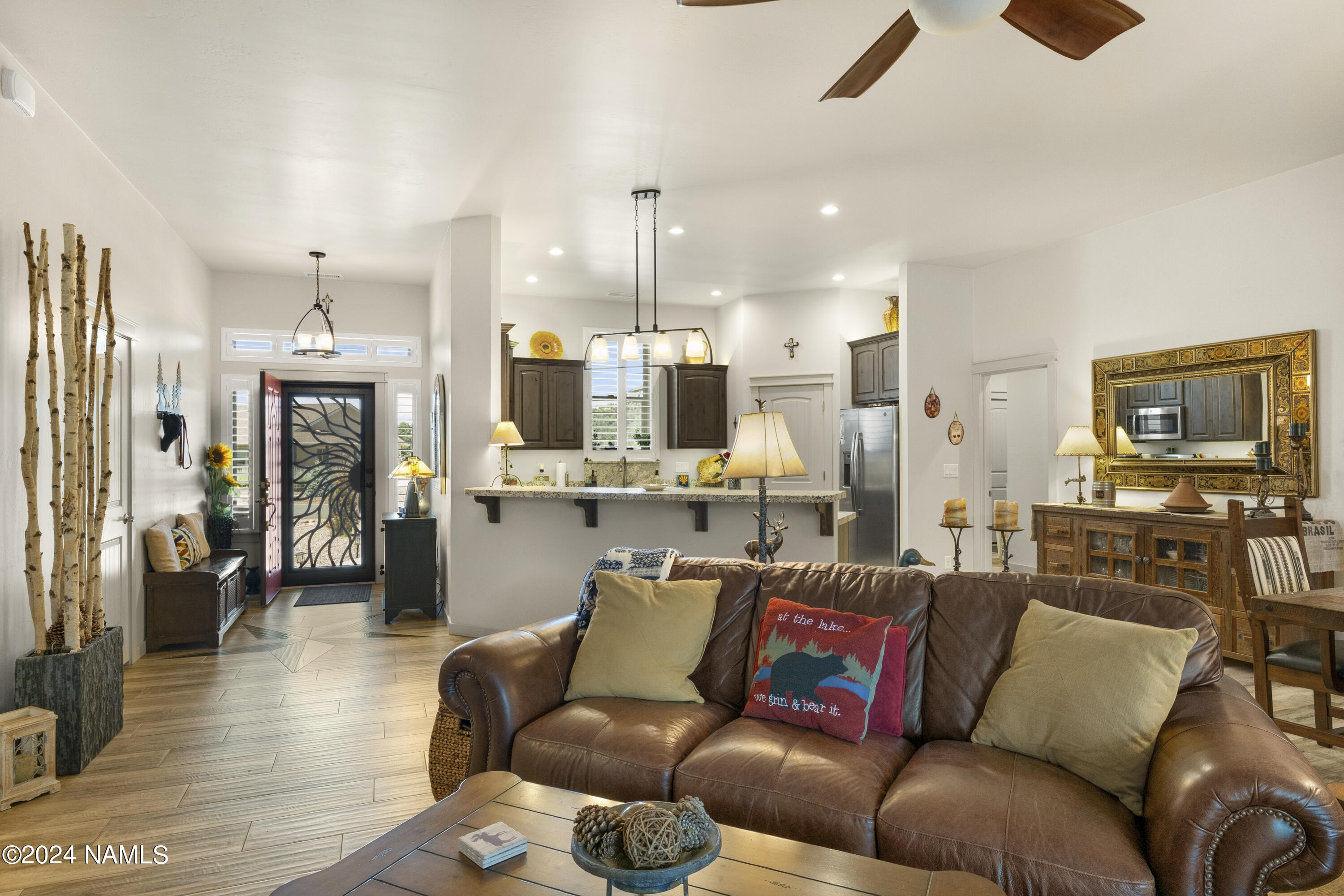 10290 Lundin Road Flagstaff, AZ 86004 - Photo 11 of 43 a living room with furniture and a flat screen tv