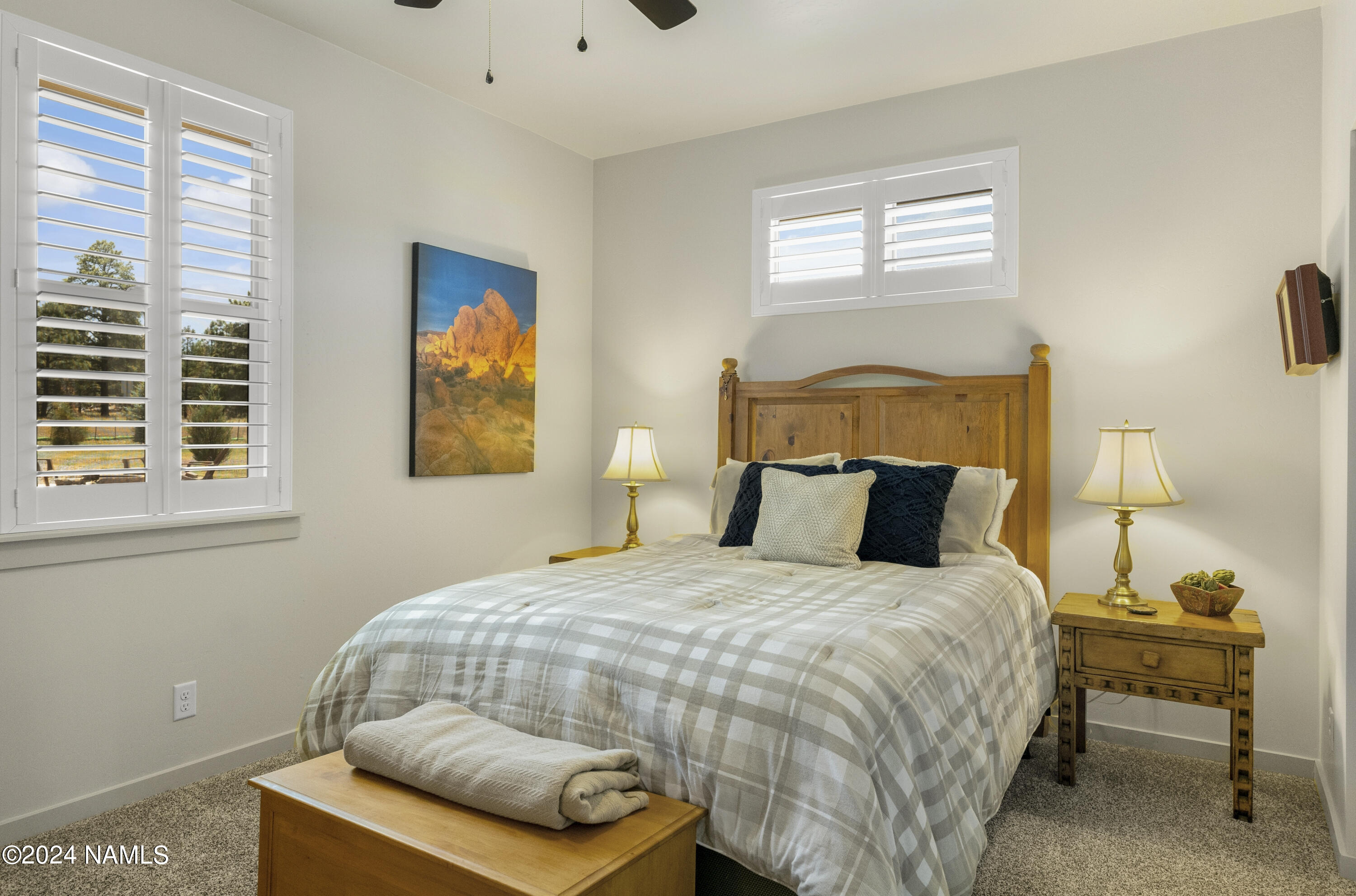 10290 Lundin Road Flagstaff, AZ 86004 - Photo 26 of 43 a bedroom with a bed and window