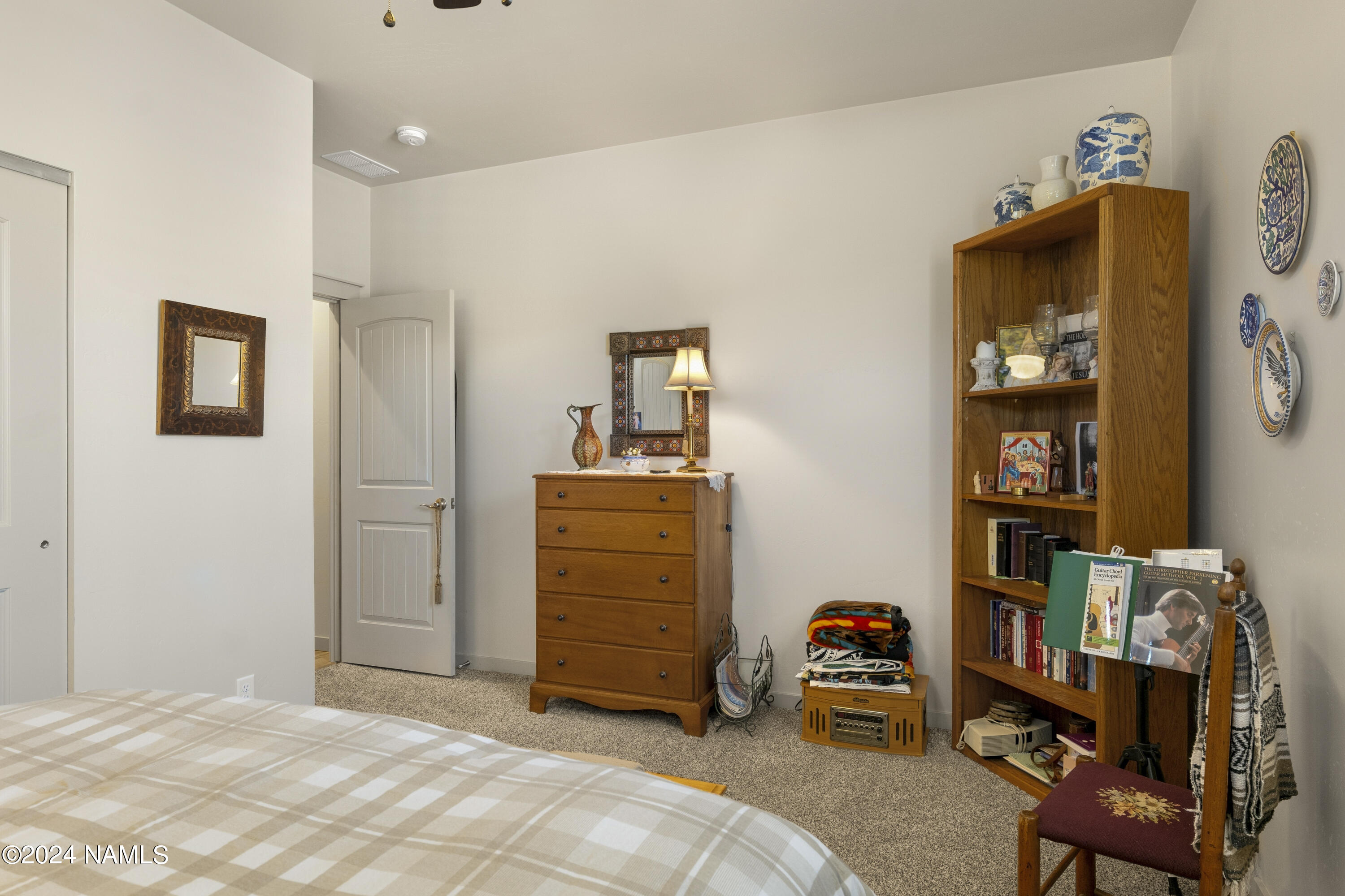 10290 Lundin Road Flagstaff, AZ 86004 - Photo 27 of 43 a room with furniture and closet
