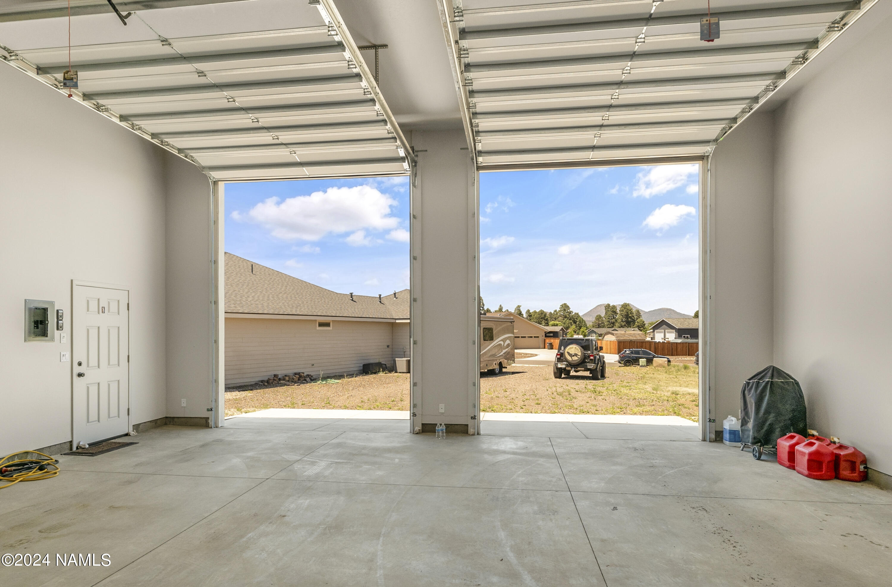 10290 Lundin Road Flagstaff, AZ 86004 - Photo 37 of 43 a view of living room with furniture and floor to ceiling window