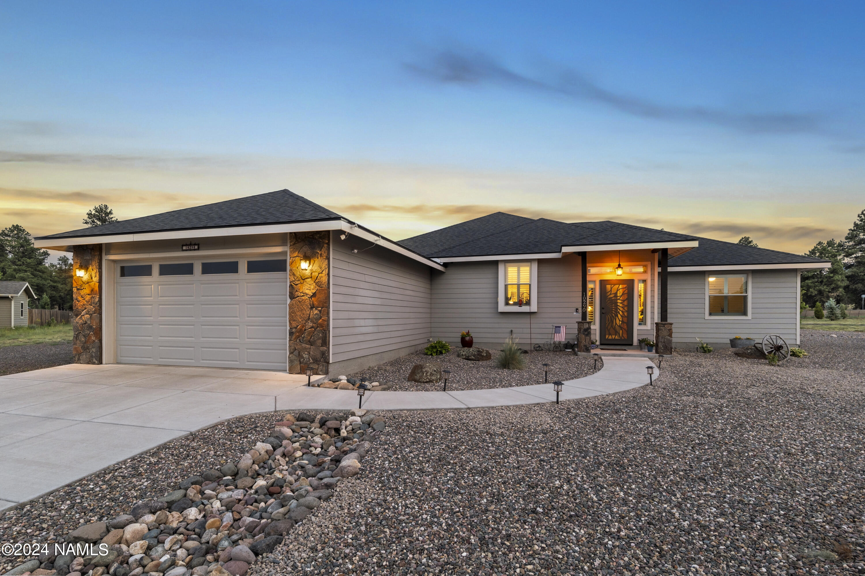 10290 Lundin Road Flagstaff, AZ 86004 - Photo 39 of 43 front view of a house with a patio