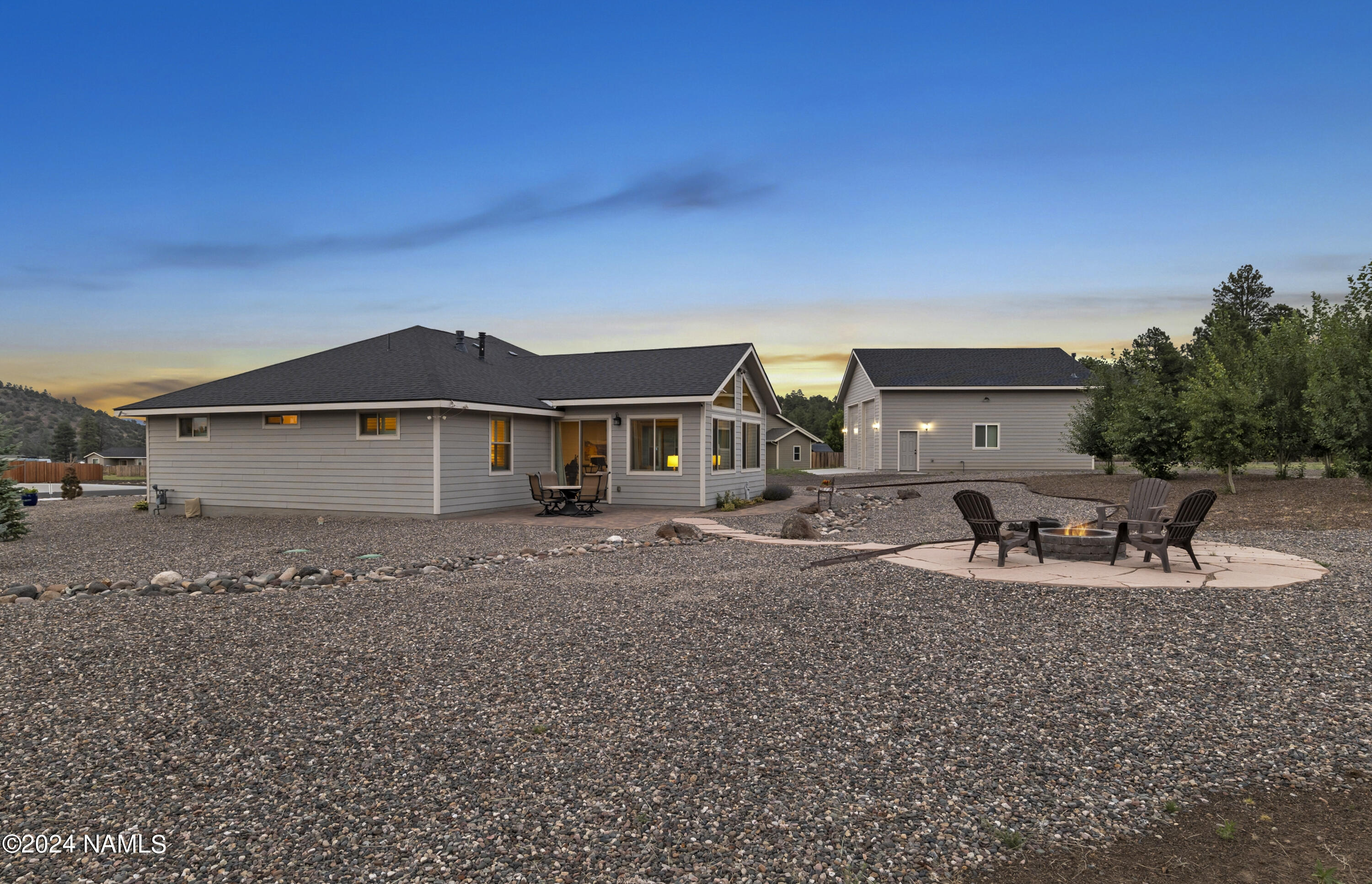 10290 Lundin Road Flagstaff, AZ 86004 - Photo 4 of 43 a front view of a house with a porch
