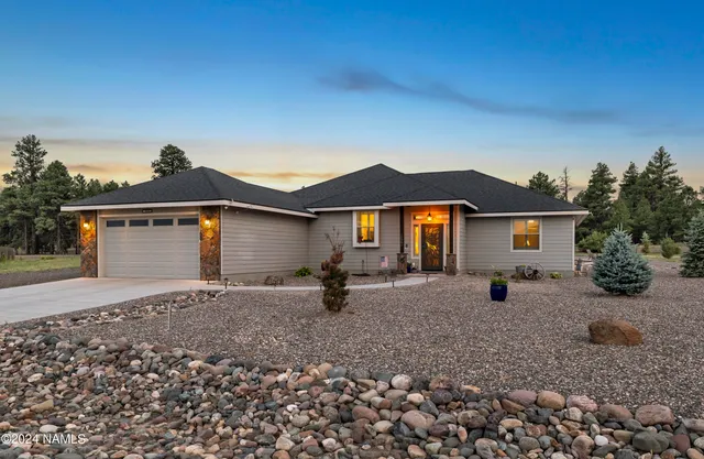 a backyard of a house with barbeque oven fire pit table and chairs
