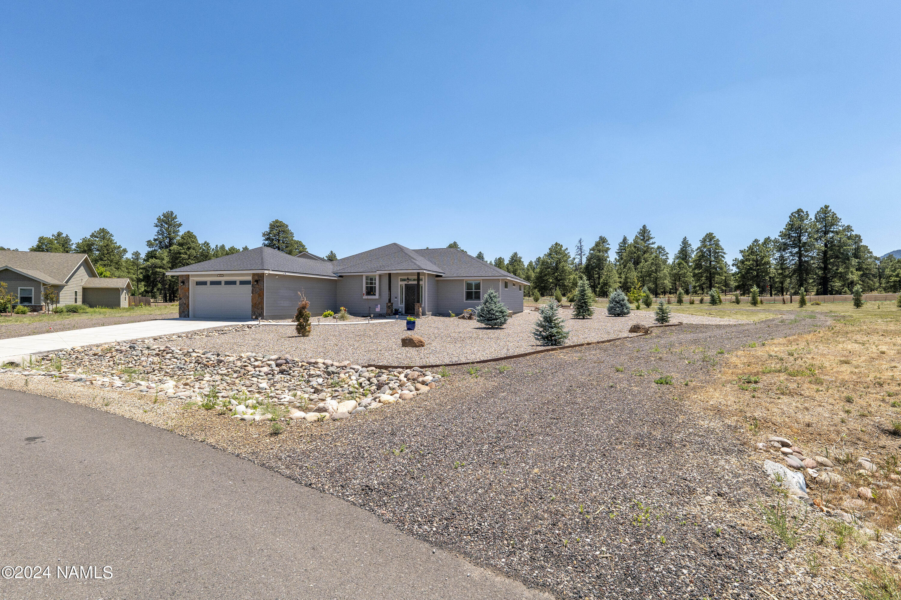 10290 Lundin Road Flagstaff, AZ 86004 - Photo 8 of 43 a front view of a house with a yard