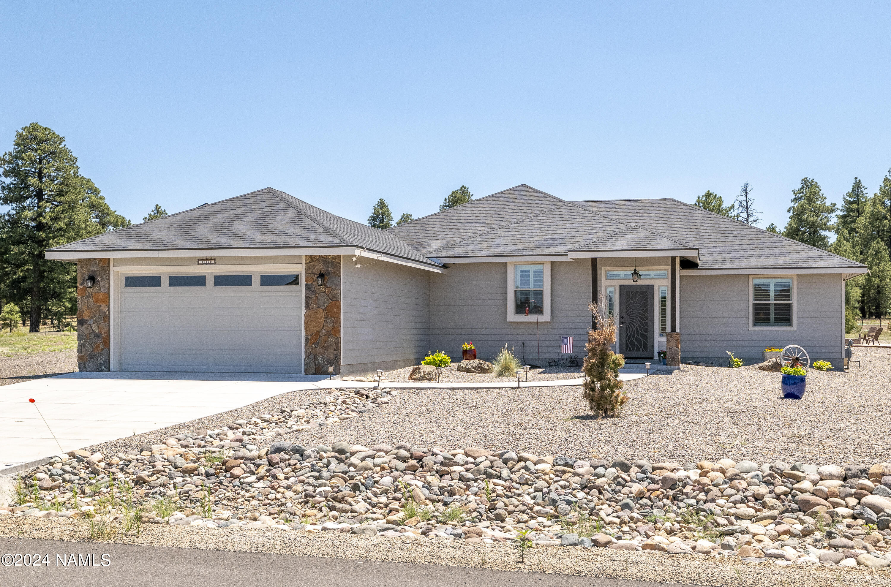 10290 Lundin Road Flagstaff, AZ 86004 - Photo 9 of 43 a front view of a house with a patio