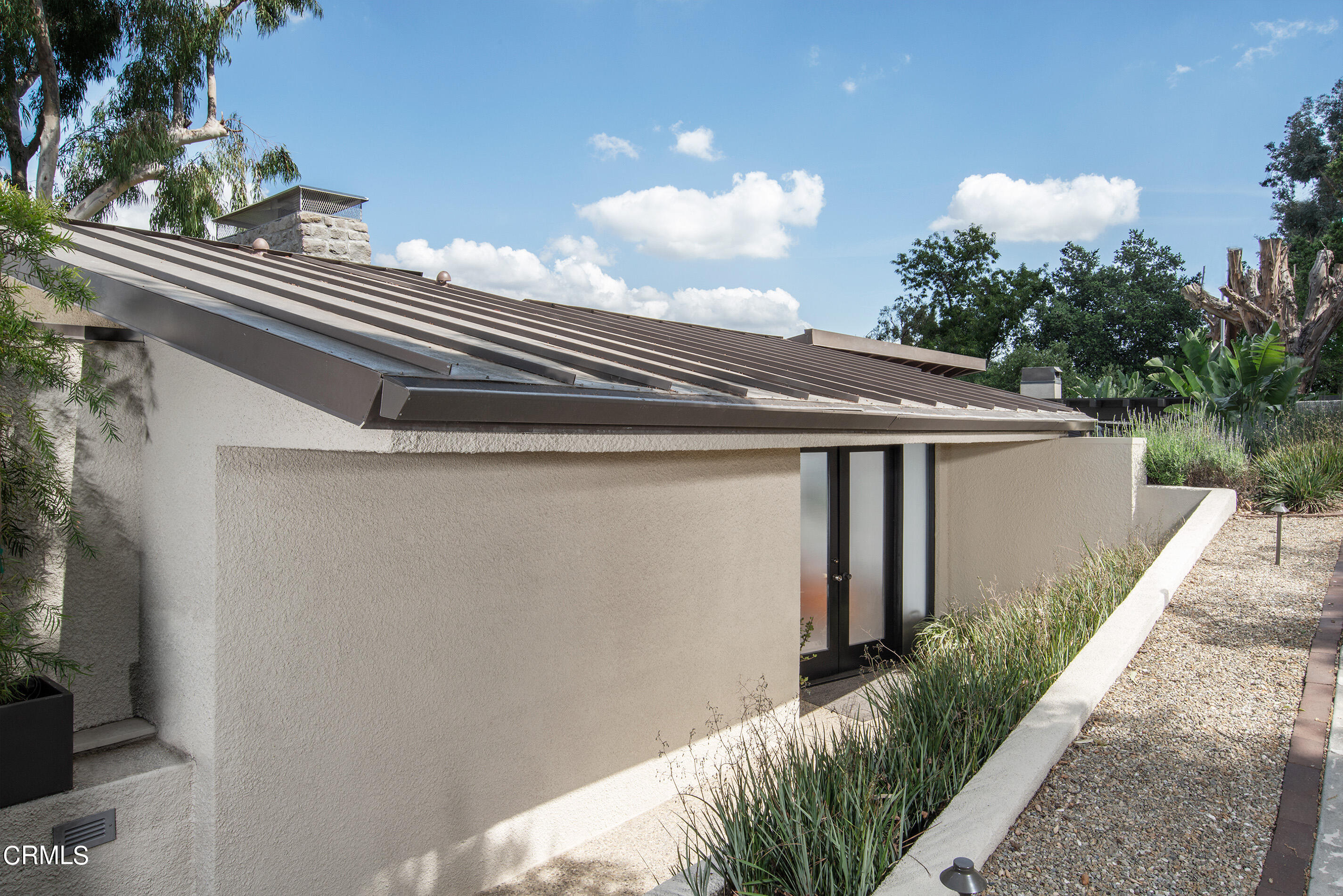 1255 Rancheros Road Pasadena, CA 91103 - Photo 3 of 10 a view of a house with a small yard