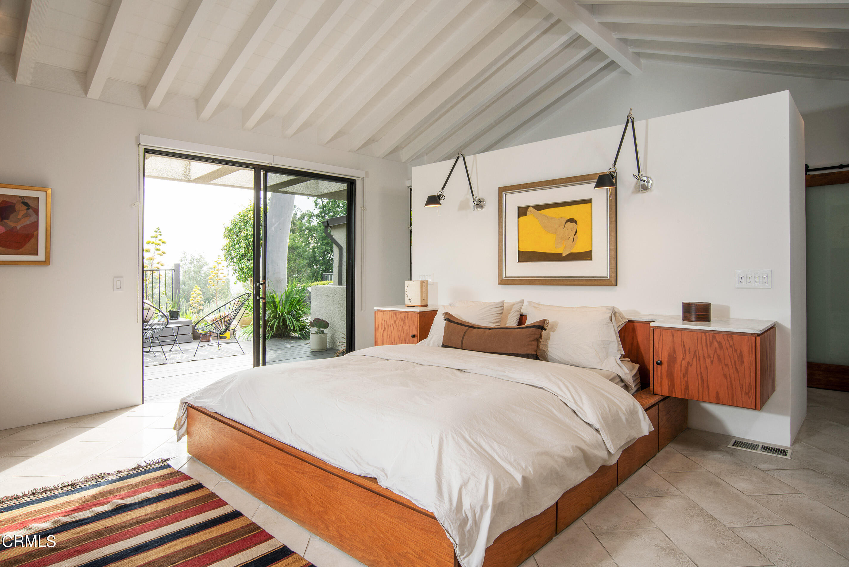 1255 Rancheros Road Pasadena, CA 91103 - Photo 6 of 10 a bedroom with a bed and glass window