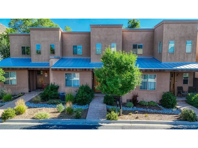 a view of house with outdoor space and sitting area