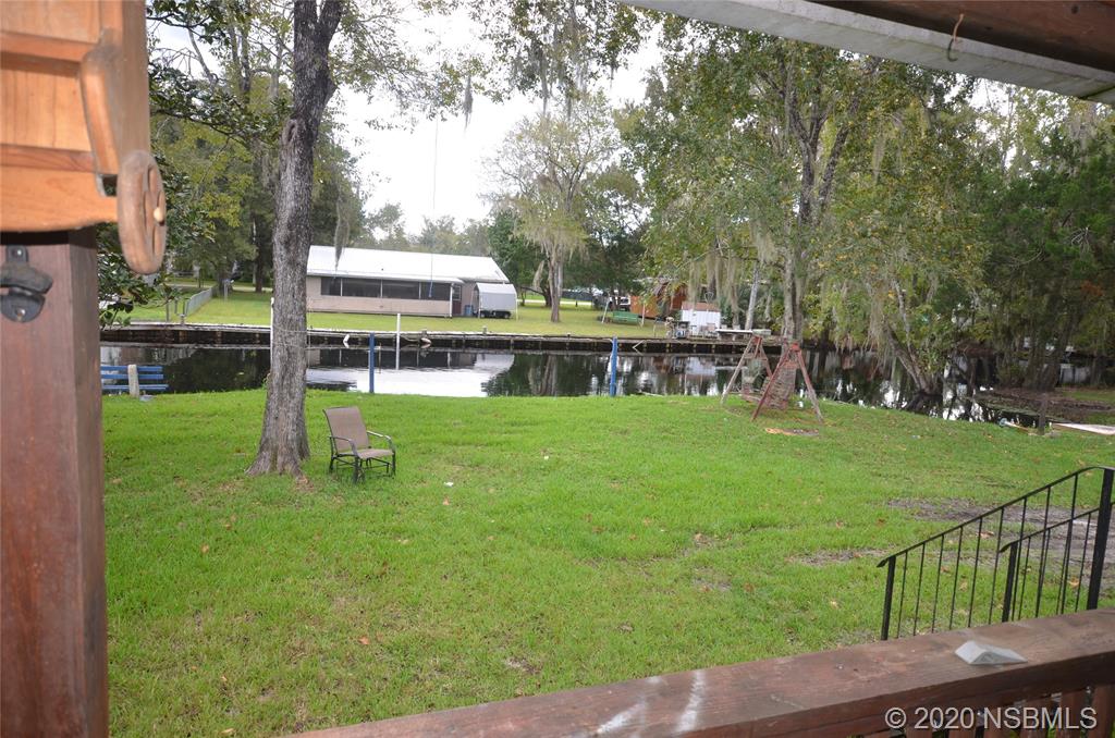 56402 Cherry Tree Road Astor, FL 32102 - Photo 5 of 6 a view of house with outdoor space and garden
