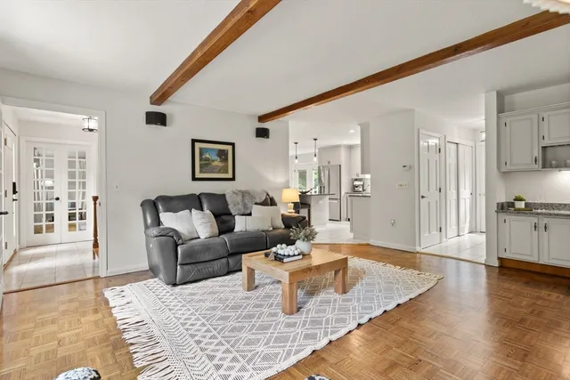 a living room with furniture and a rug