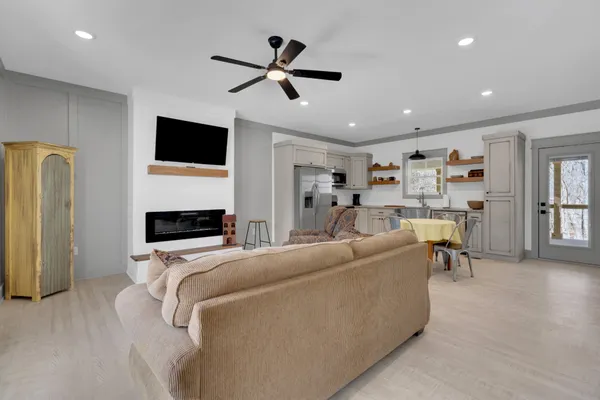 a living room with furniture and a fireplace