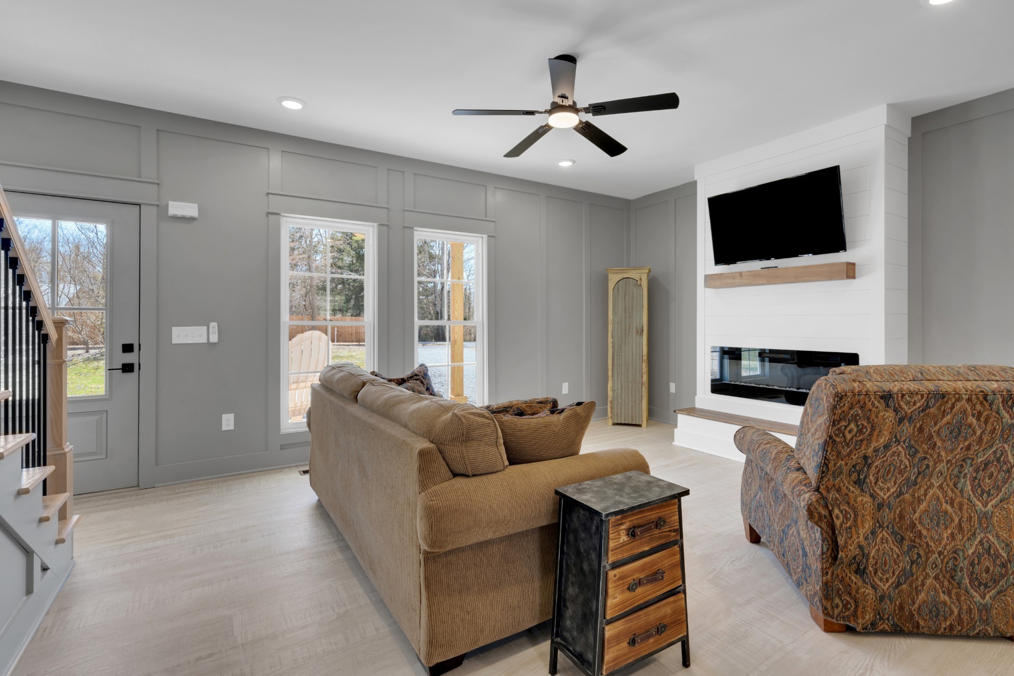 555 Ghea Road Normandy, TN 37360 - Photo 21 of 43 a living room with furniture a ceiling fan and a flat screen tv