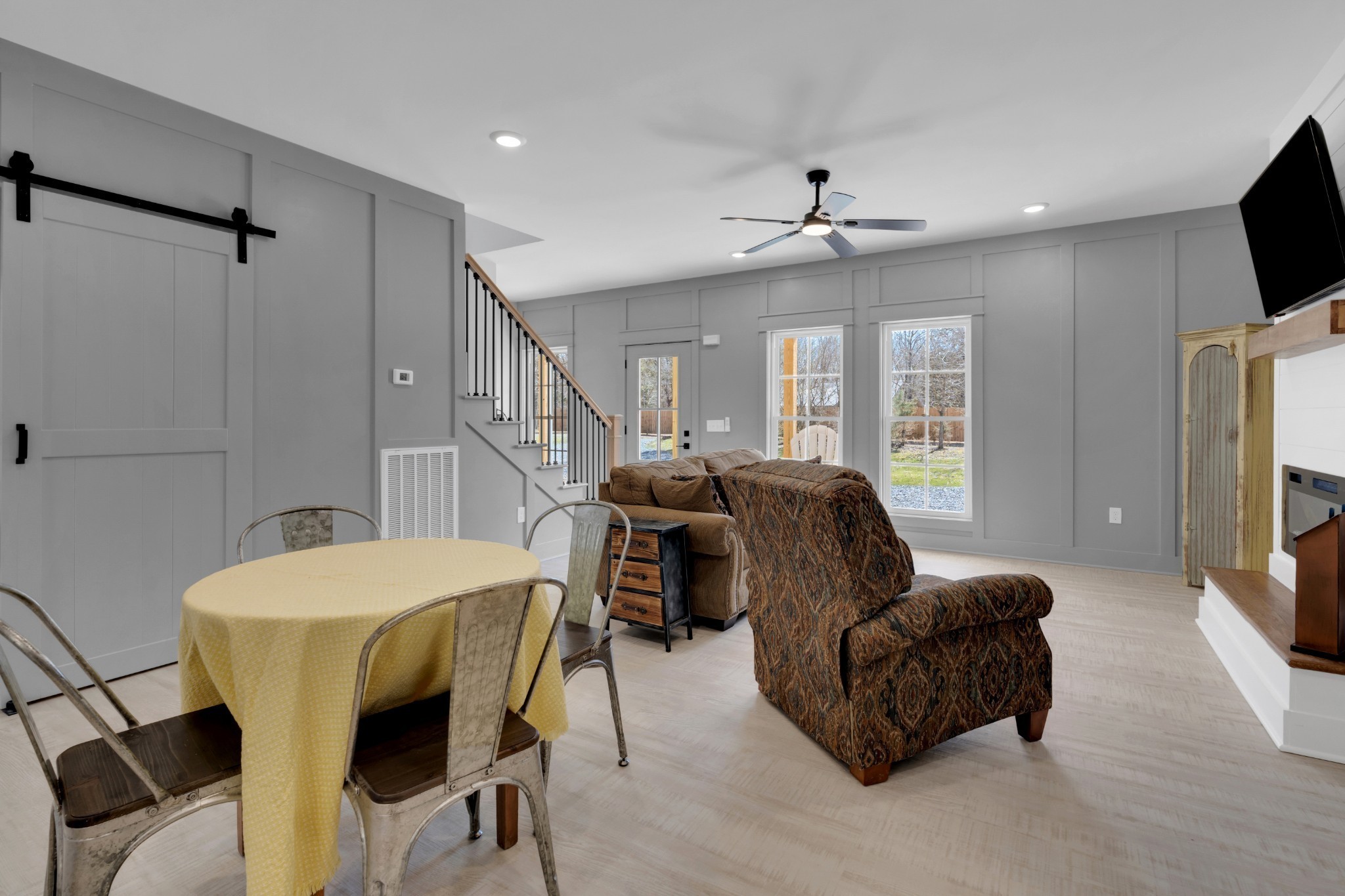 555 Ghea Road Normandy, TN 37360 - Photo 22 of 43 a living room with furniture a flat screen tv and a chandelier