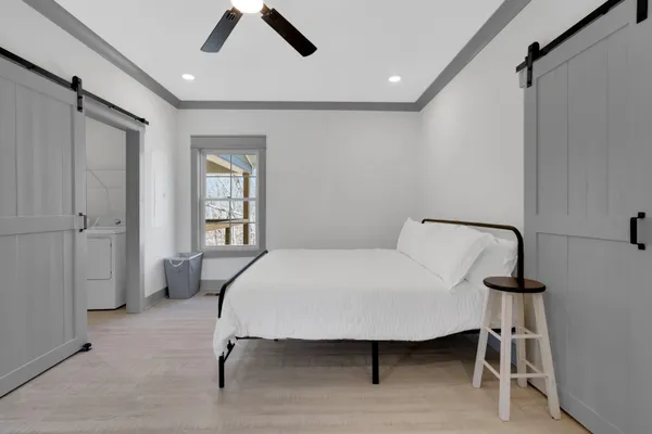 a bedroom with a bed and a table