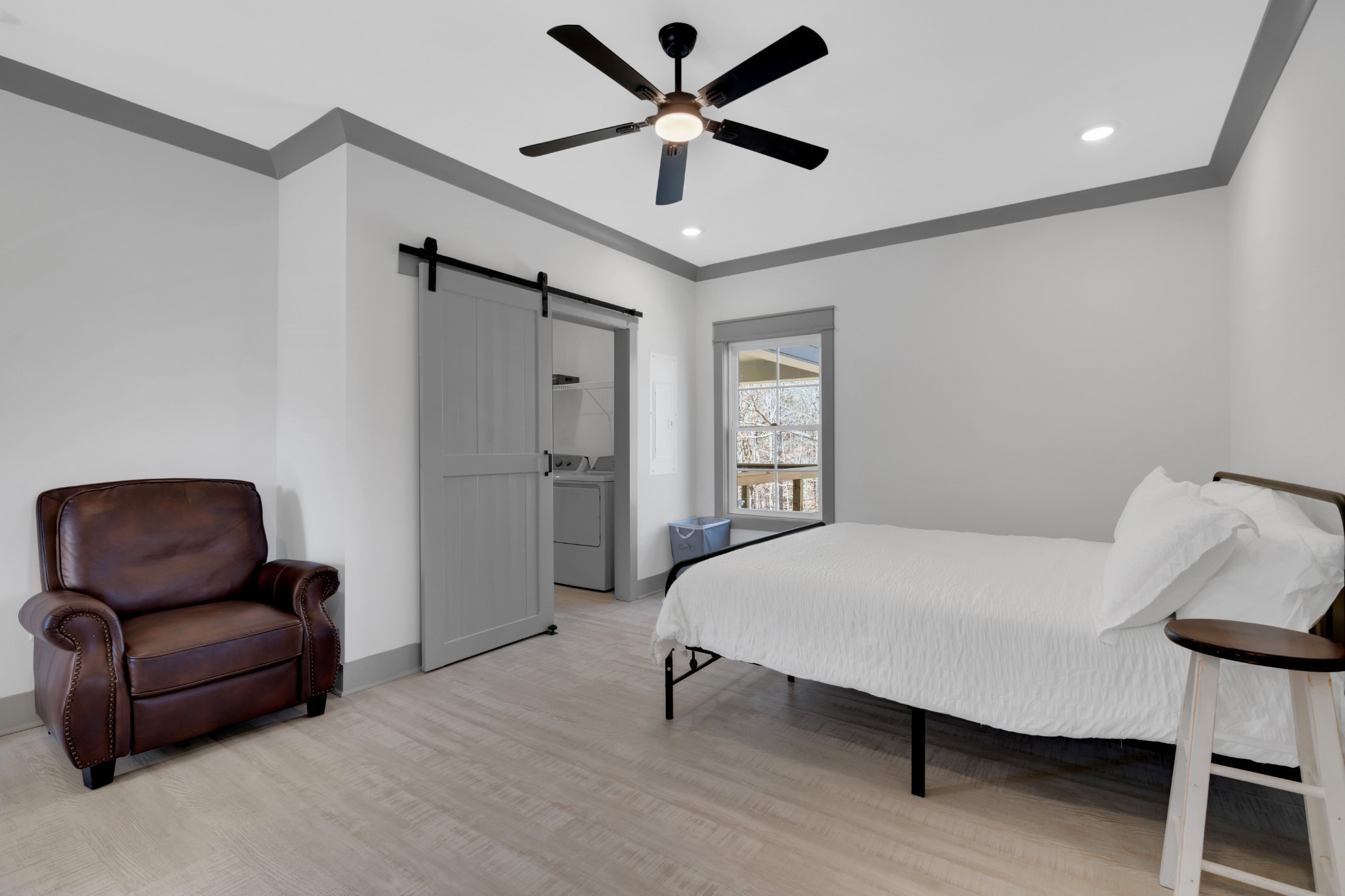 555 Ghea Road Normandy, TN 37360 - Photo 32 of 43 a bedroom with a bed and a chair