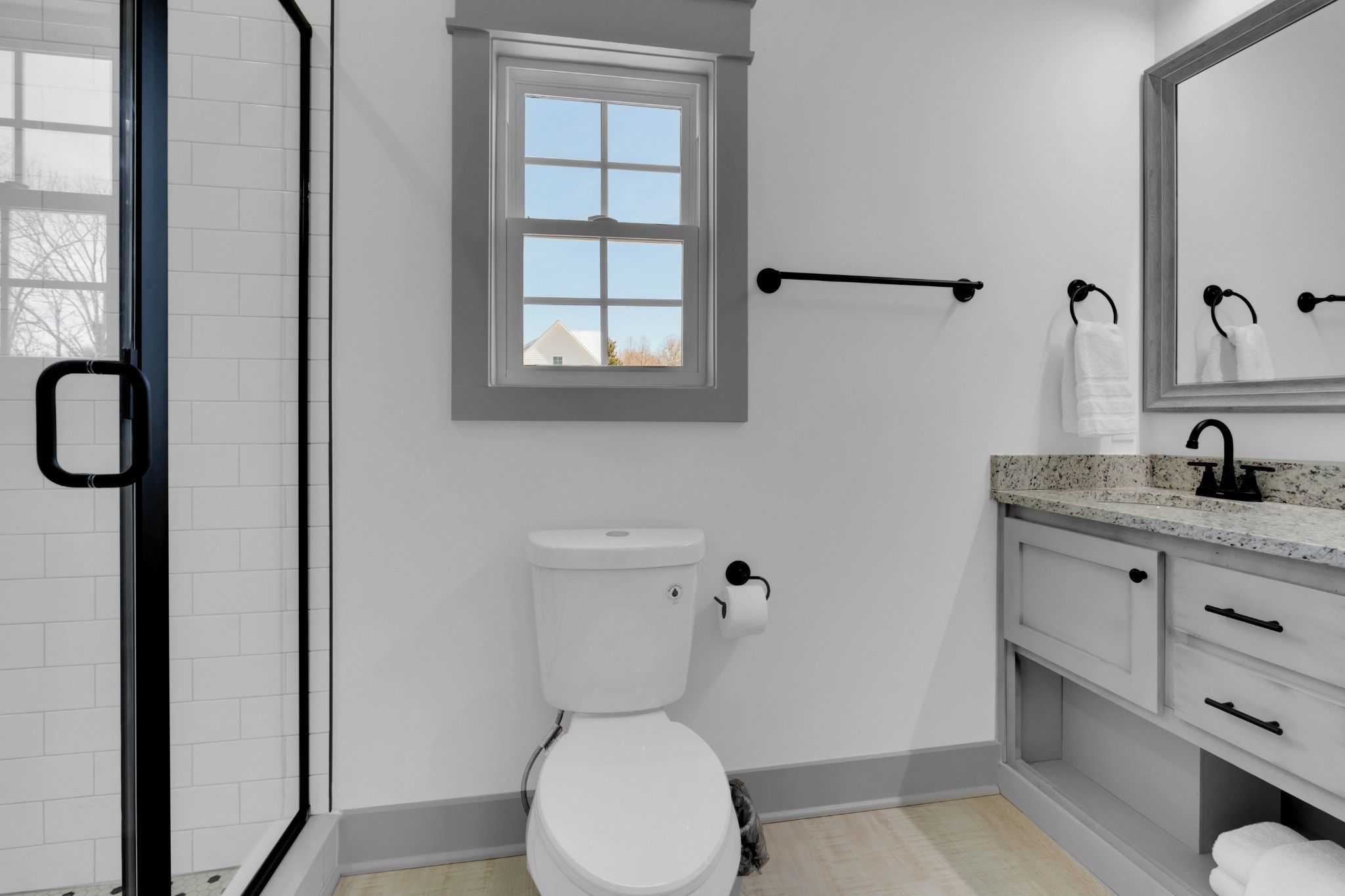 555 Ghea Road Normandy, TN 37360 - Photo 33 of 43 a bathroom with a granite countertop toilet sink and mirror