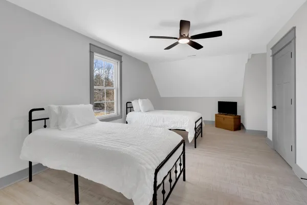 a bedroom with a bed and a table