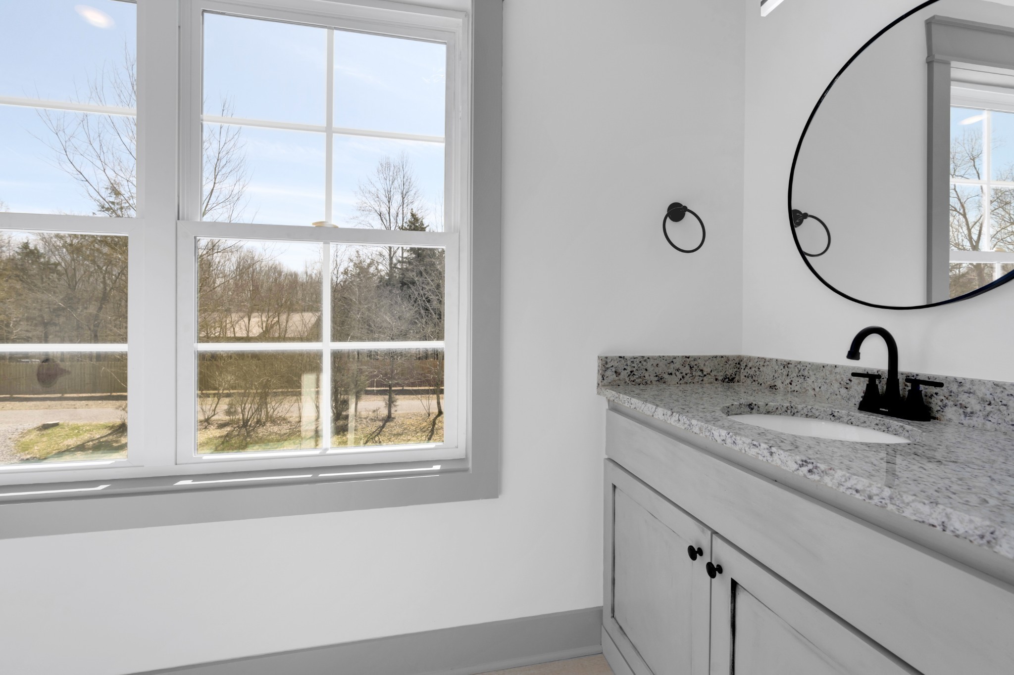 555 Ghea Road Normandy, TN 37360 - Photo 43 of 43 a bathroom with a granite countertop sink and a window