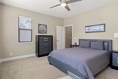 a bedroom with a bed and a closet