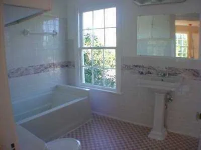 a bathroom with a sink a bathtub and window