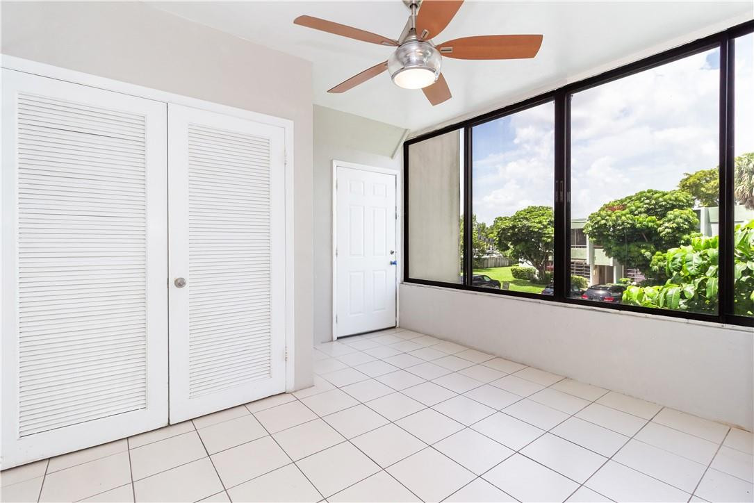 3992 North Pine Island Road, Unit 2A Sunrise, FL 33351 - Photo 1 of 18 an empty room with windows and outdoor view
