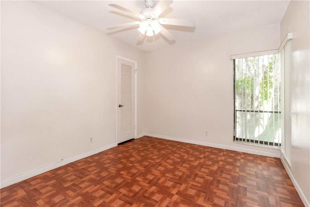 3992 North Pine Island Road, Unit 2A Sunrise, FL 33351 - Photo 12 of 18 an empty room with windows and fan