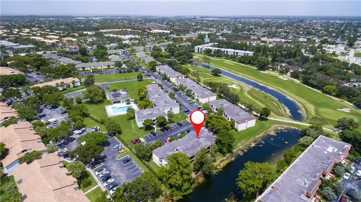 3992 North Pine Island Road, Unit 2A Sunrise, FL 33351 - Photo 17 of 18 an aerial view of residential houses with outdoor space