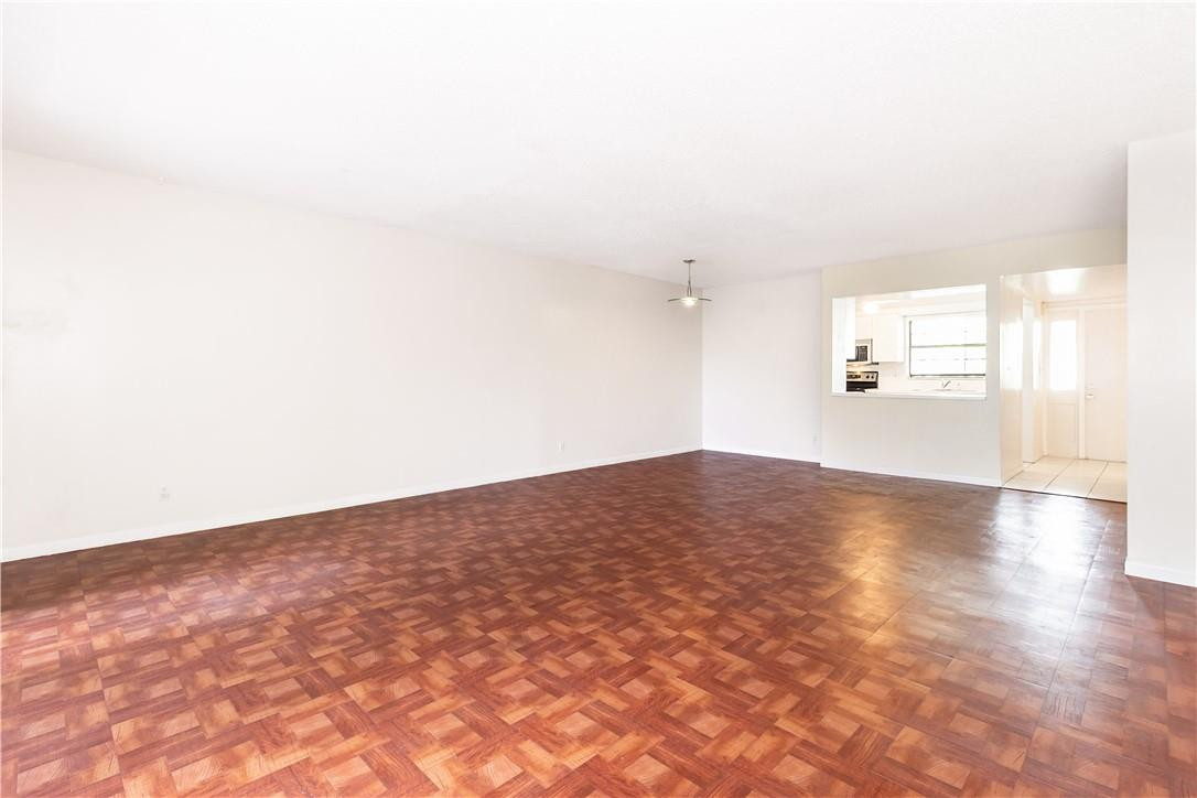 3992 North Pine Island Road, Unit 2A Sunrise, FL 33351 - Photo 2 of 18 a view of empty room with wooden floor and fan