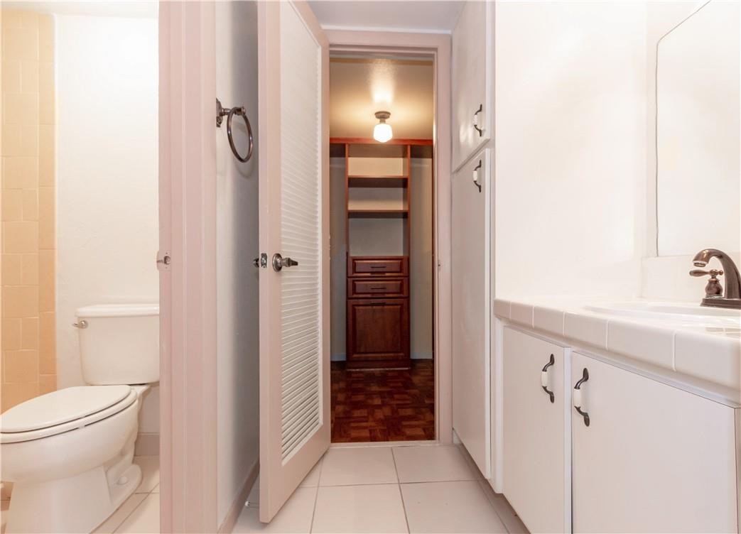 3992 North Pine Island Road, Unit 2A Sunrise, FL 33351 - Photo 9 of 18 a bathroom with a sink a toilet and shower