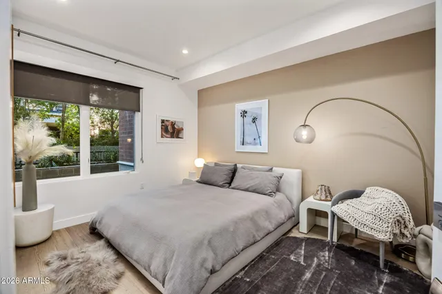 a bathroom with a toilet a sink and a mirror