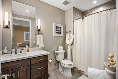 a view of a livingroom with workspace and a couch