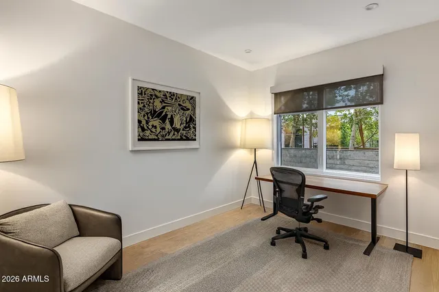 a bathroom with a granite countertop sink mirror and shower